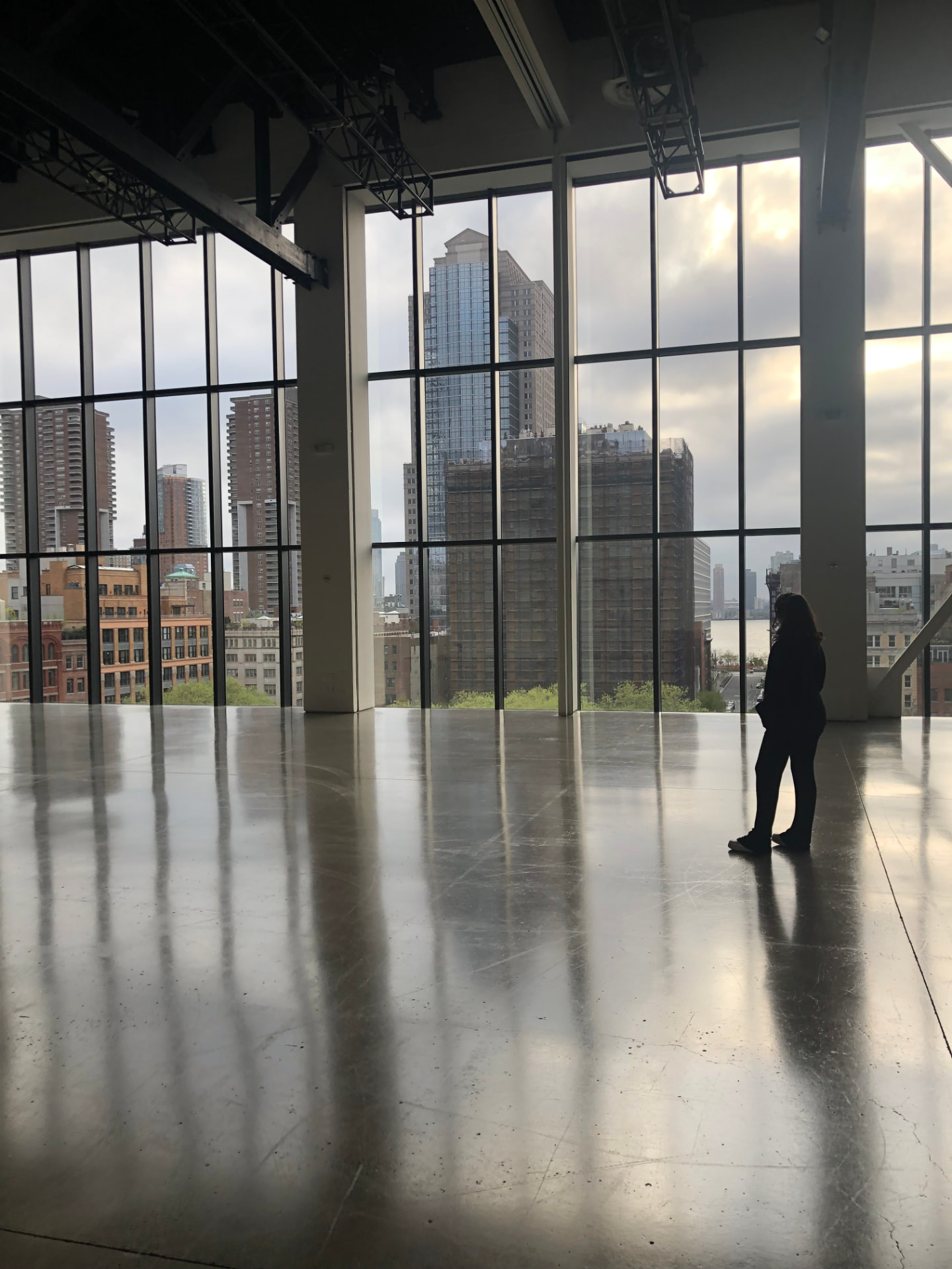 Terri Trovato, founder of The Darcy Agency, in a studio space overlooking the New York skyline